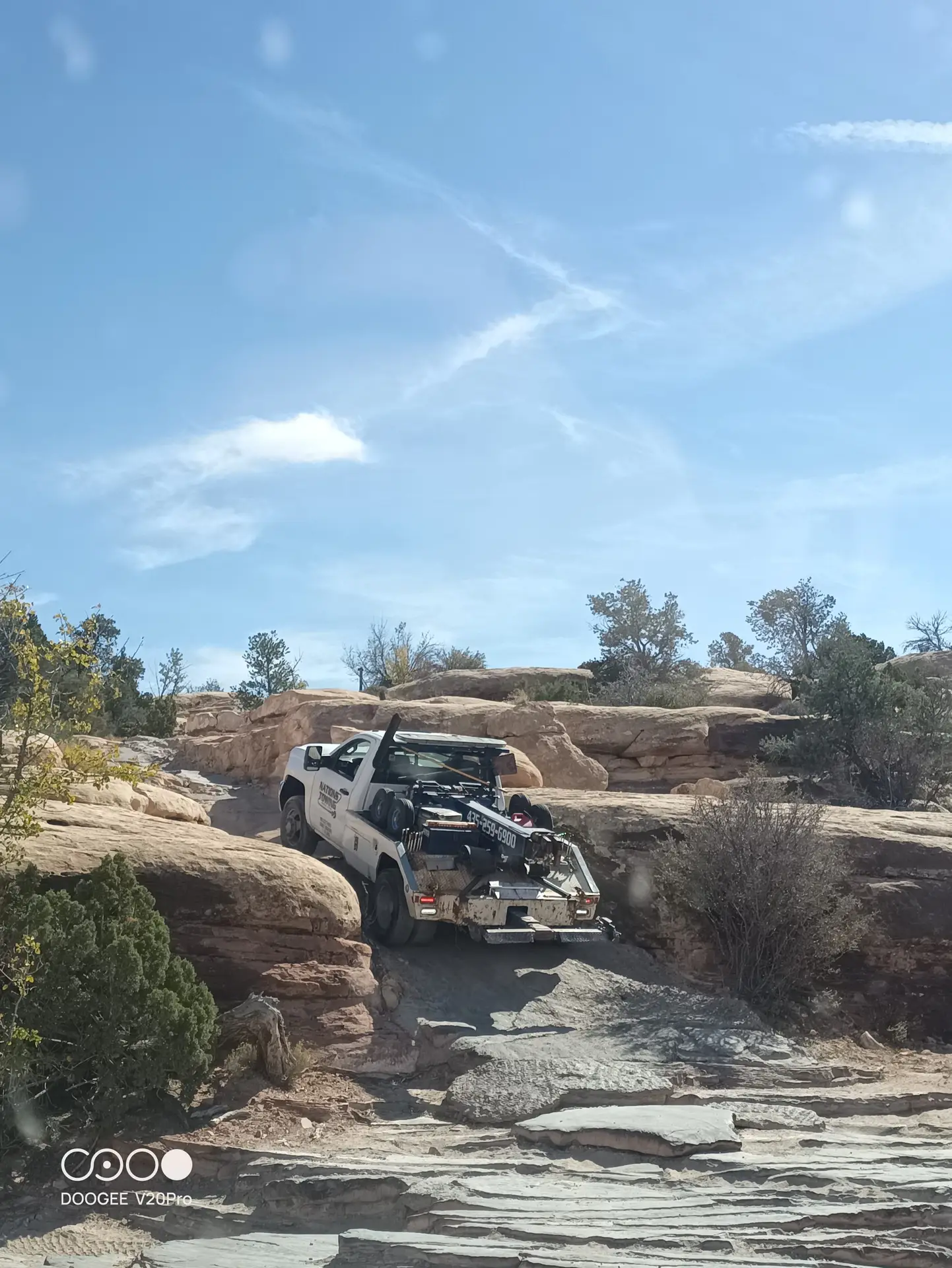 Moab tow truck getting muddy.